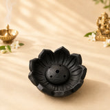 Leela black clay lotus-shaped incense burner with three small ventilation holes and a central opening