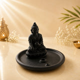 Leela black ceramic incense burner featuring a meditating Buddha on a round ash-catching tray with two incense-stick holes.