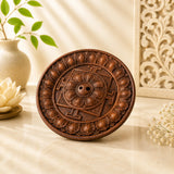 Leela round brown clay incense holder with an intricately carved lotus mandala design and central incense openings