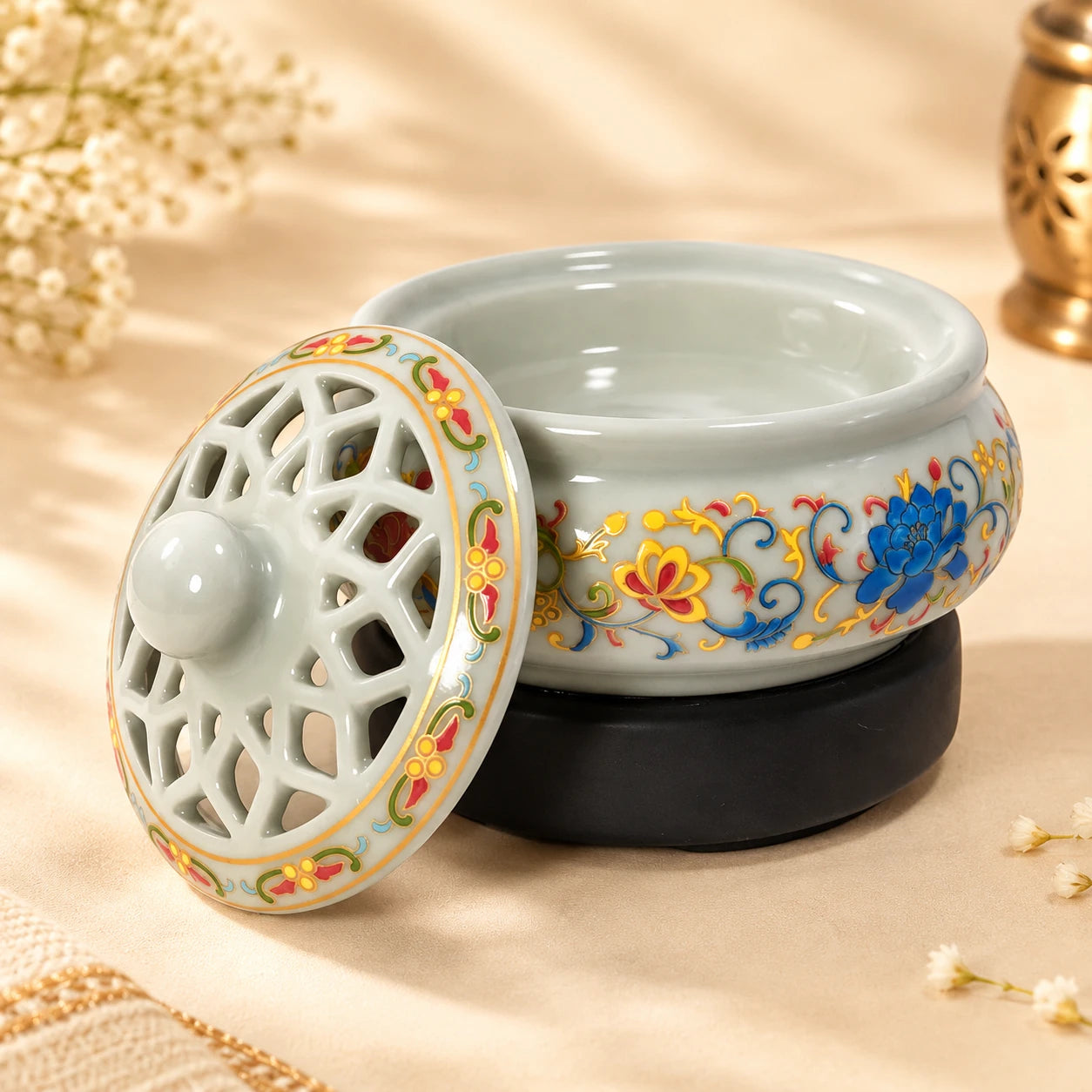 Leela Designer Floral Electric Incense Burner with its pierced ceramic lid removed
