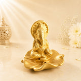 Leela handmade terracotta Lord Ganesha incense holder in a golden finish, seated on a lotus-shaped base