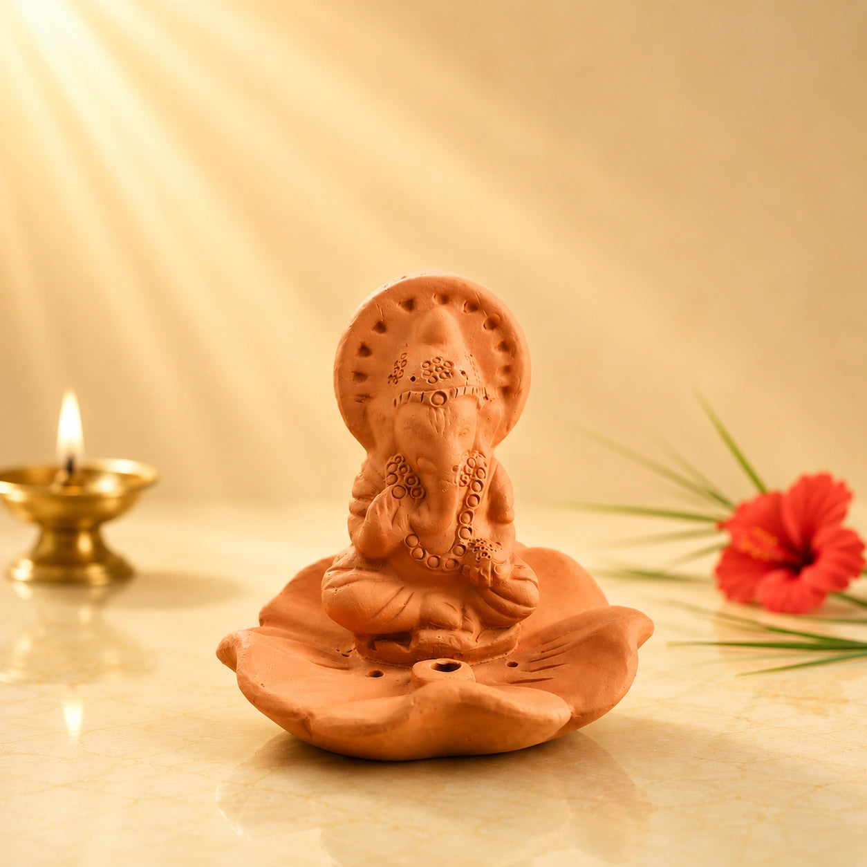 Leela handmade terracotta Lord Ganesha incense holder seated on a lotus-shaped base