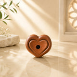 Leela mini terracotta clay incense burner with a heart-shaped design and central incense opening