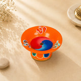 Leela orange hand-painted incense burner with Om symbols, a red-and-blue yin-yang design and a central incense holder.