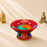 Leela red hand-painted Tibetan incense burner with colourful Om symbols, a yin-yang design and a central incense holder.