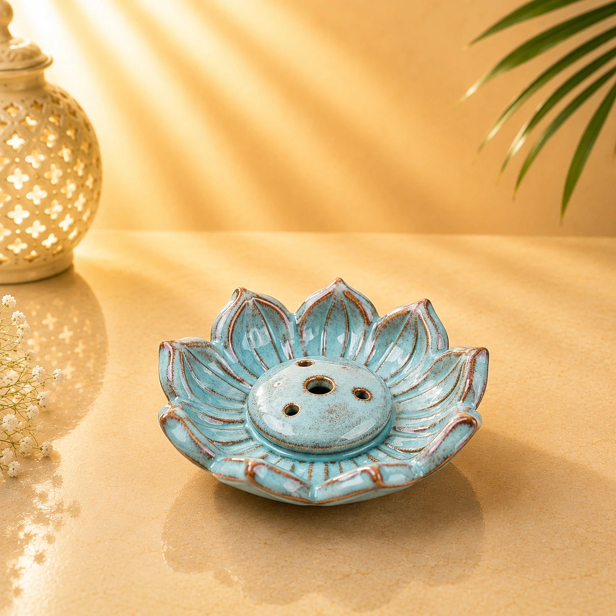 Sky-blue lotus-shaped ceramic incense burner with distressed detailing and multiple incense-stick holes.