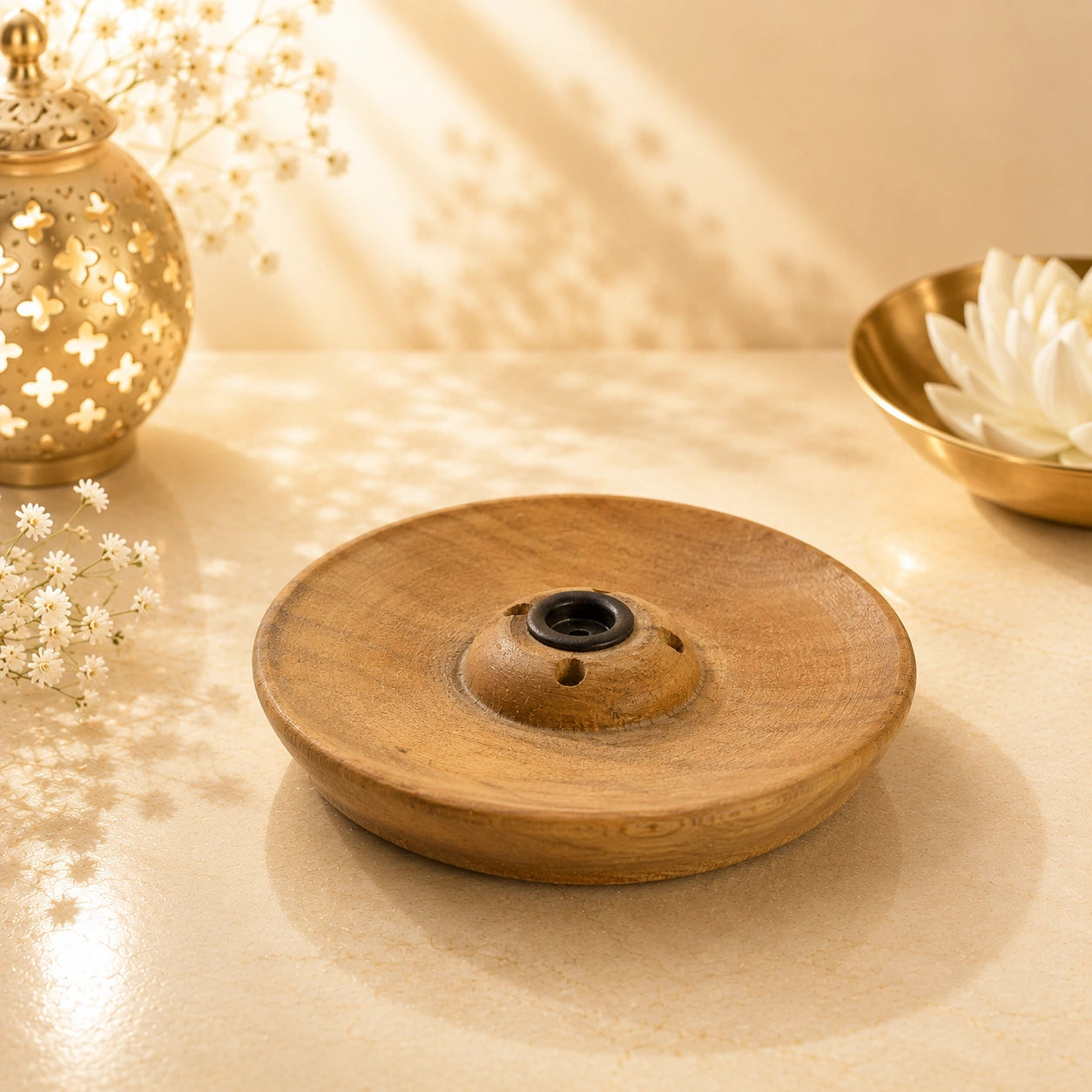 Leela small round wooden incense burner with a central holder and three ventilation holes.