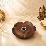Leela small dark brown flower-shaped wooden incense burner with three ventilation holes and a central metal incense holder.