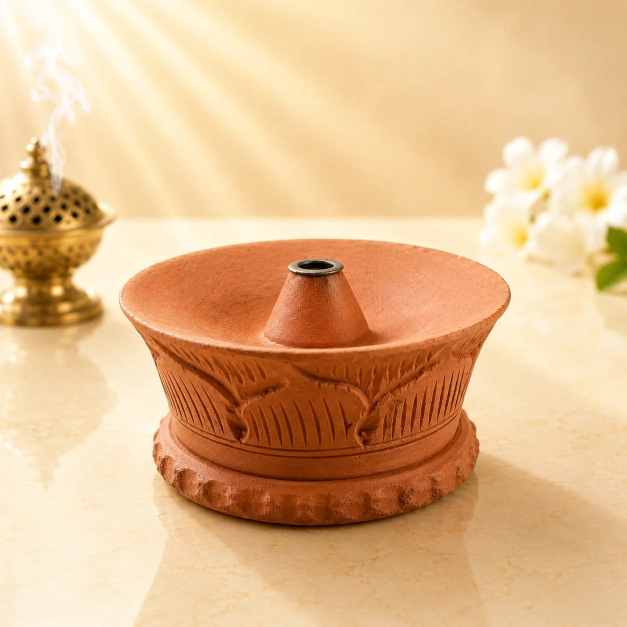 Leela terracotta Gompa incense burner featuring hand-carved leaf patterns and a raised central incense-stick holder.